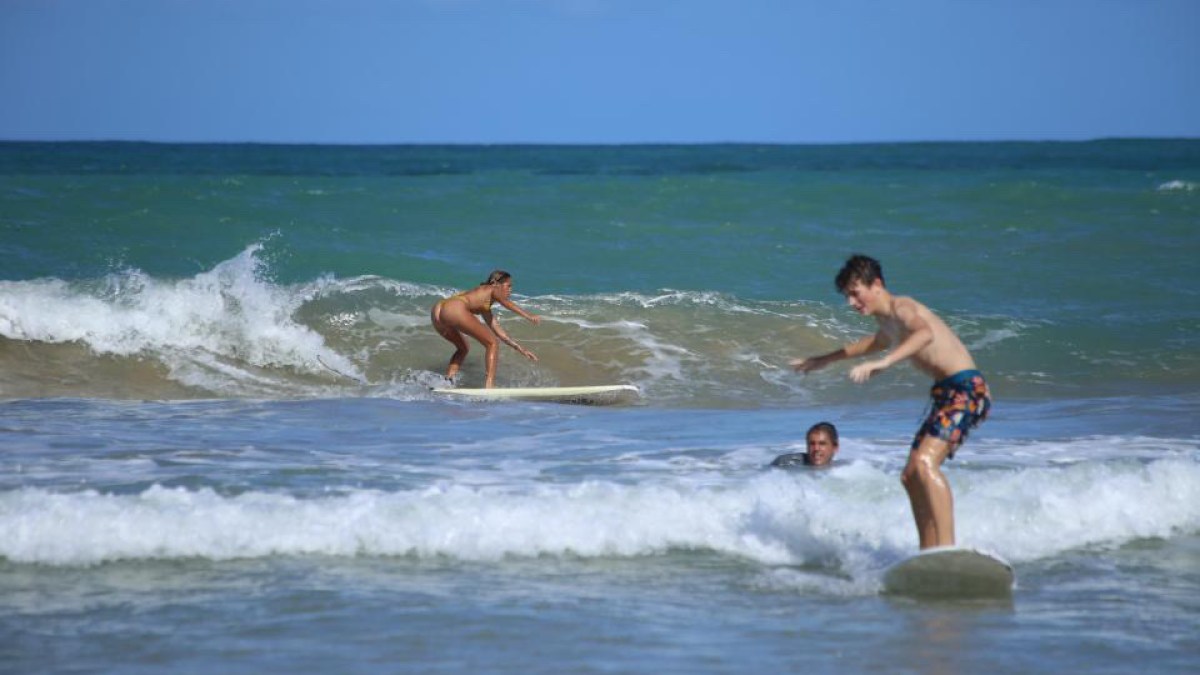 a person riding a wave on a surfboard in the water